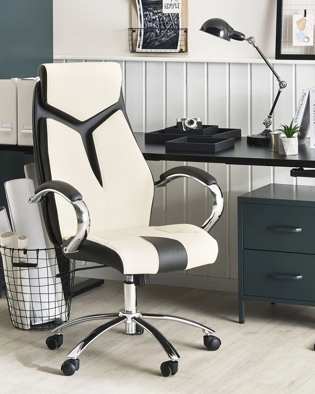 White and black office chair in a home office setting with a desk and decor.