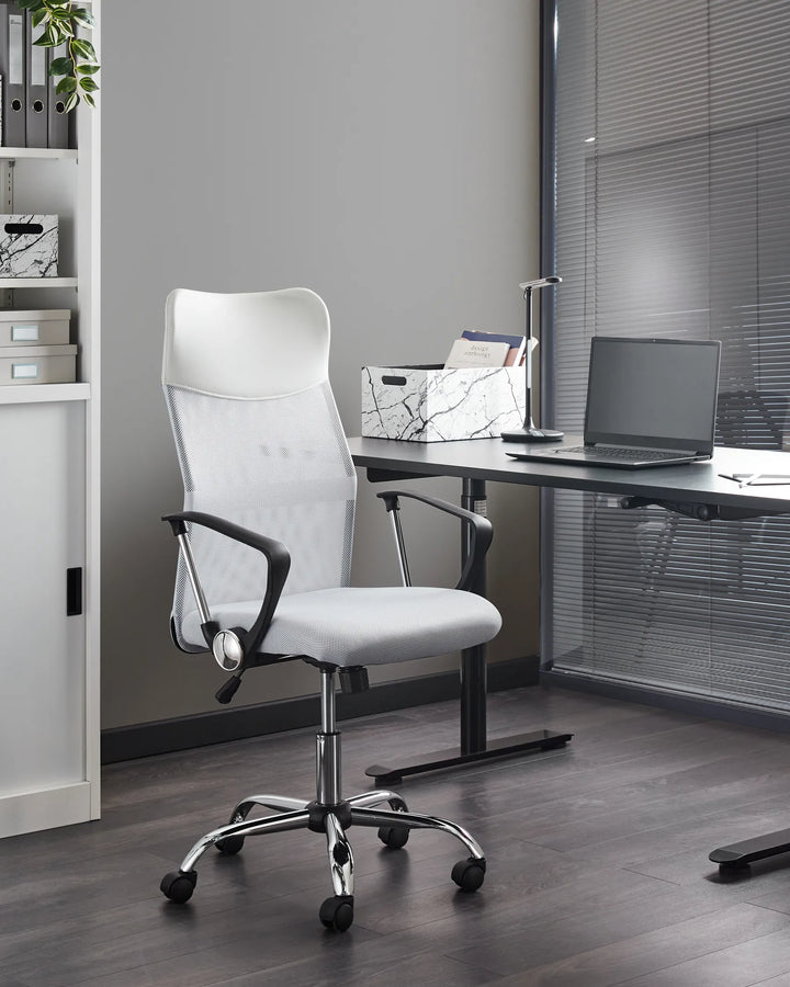 White office chair in an office setting with a desk and laptop.