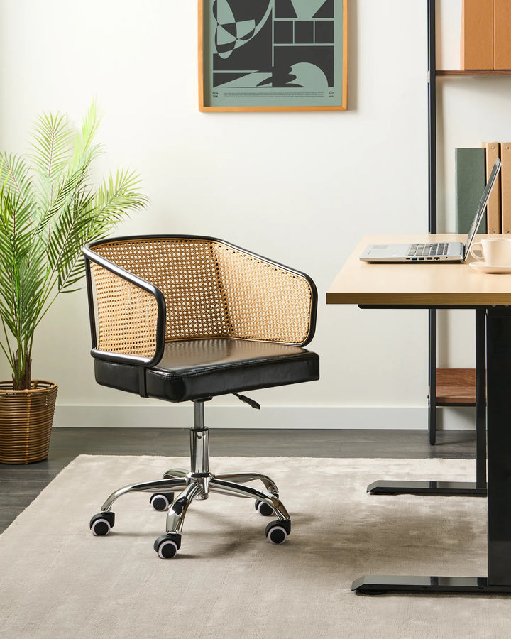Black office chair with woven backrest in a modern office setting