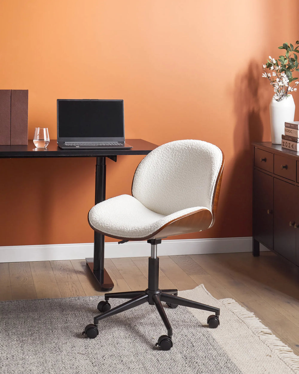 Featuring a plush boucle fabric that invites you to settle in for productive hours. 