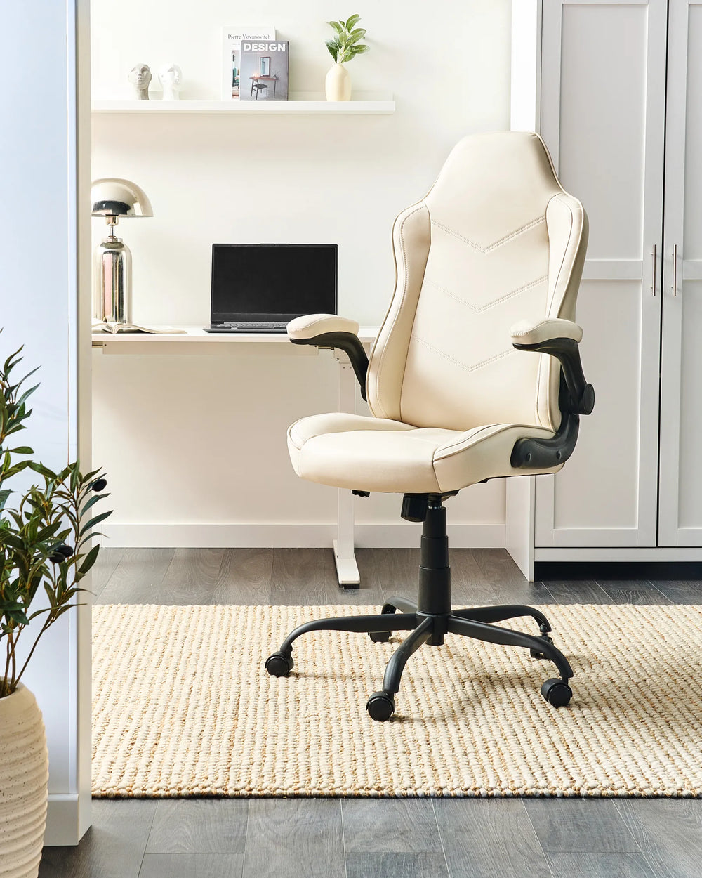 Beige office chair in a home office setting with a desk and decor.