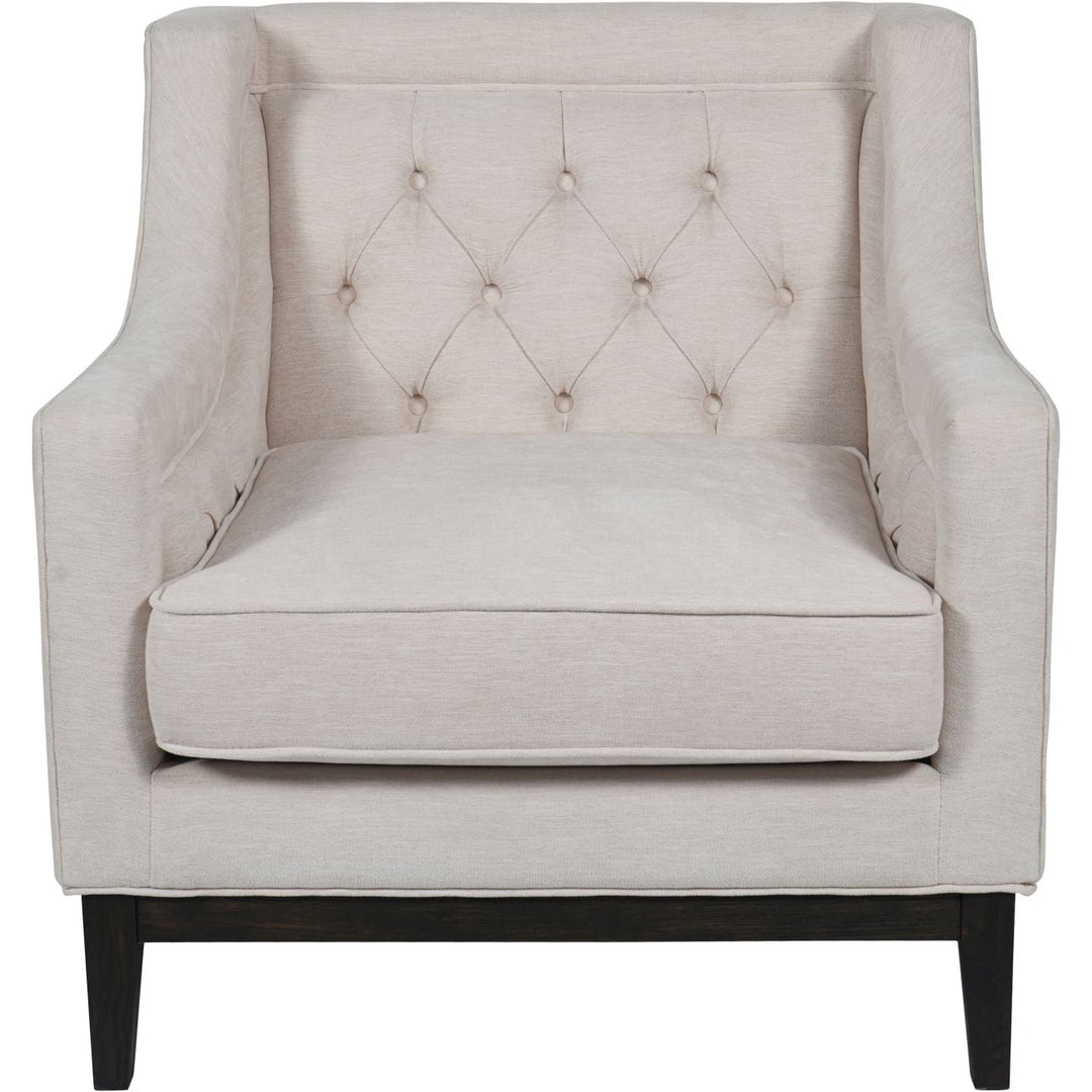 Beige armchair with tufted backrest on a white background