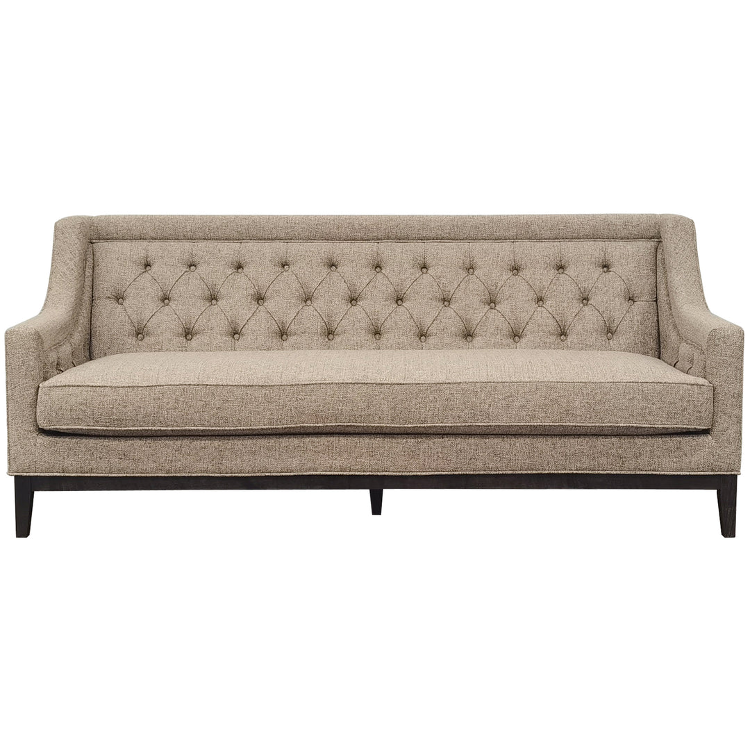 Beige tufted sofa on a white background