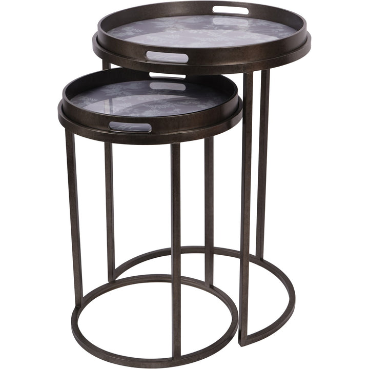 Set of two round nesting tables with marble-like tops on a white background