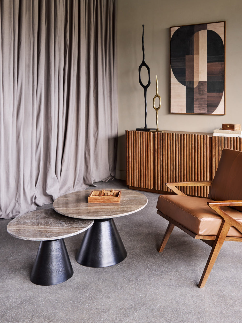 Modern living room with wooden furniture, abstract art, and a curtain.