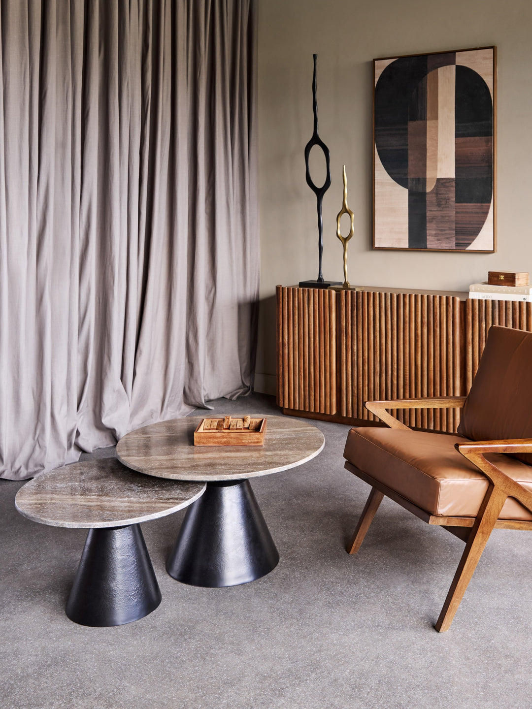 Modern living room with wooden furniture, abstract art, and a curtain.