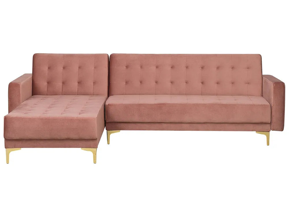 Pink sectional sofa with tufted backrests on a white background