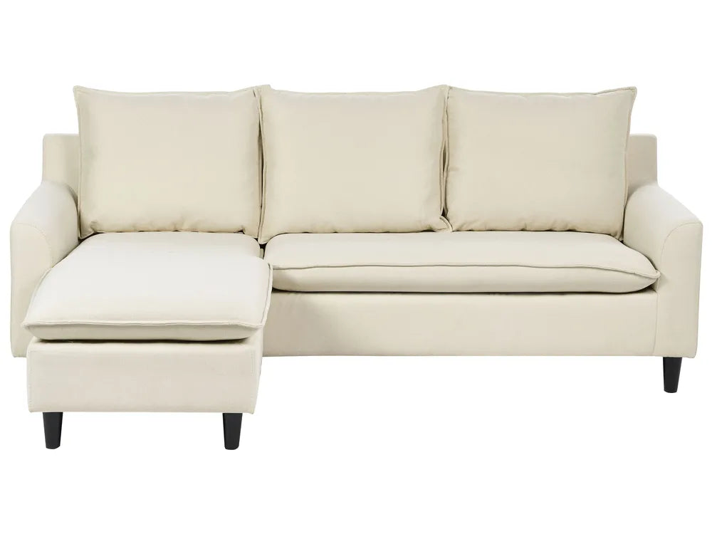 Beige sectional sofa with chaise on a white background