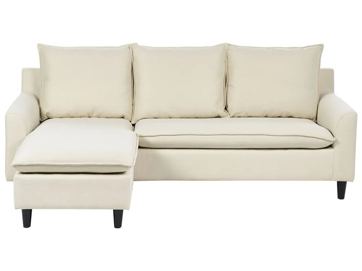 Beige sectional sofa with chaise on a white background
