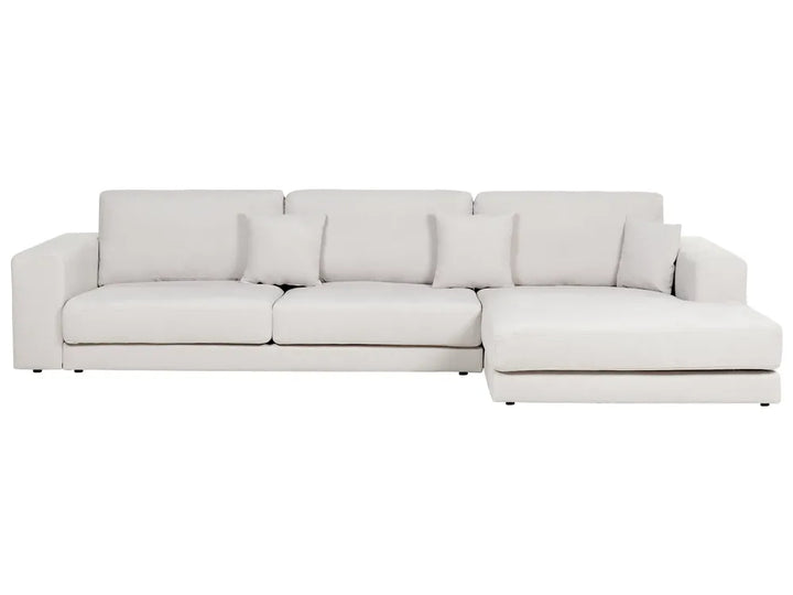 Light gray sectional sofa on a white background