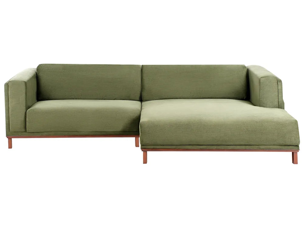 Green sectional sofa with a close-up of the fabric texture on a white background