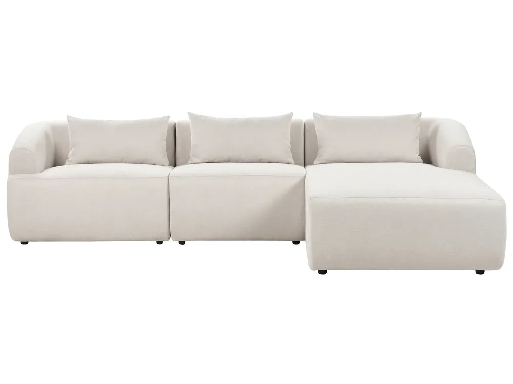 Beige sectional sofa on a white background