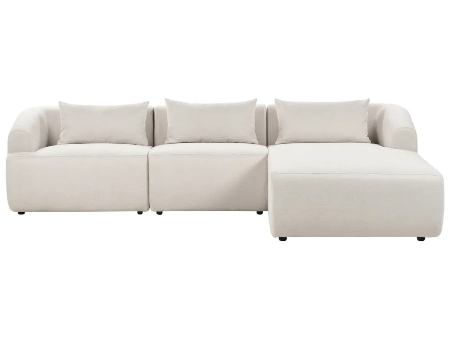 Beige sectional sofa on a white background
