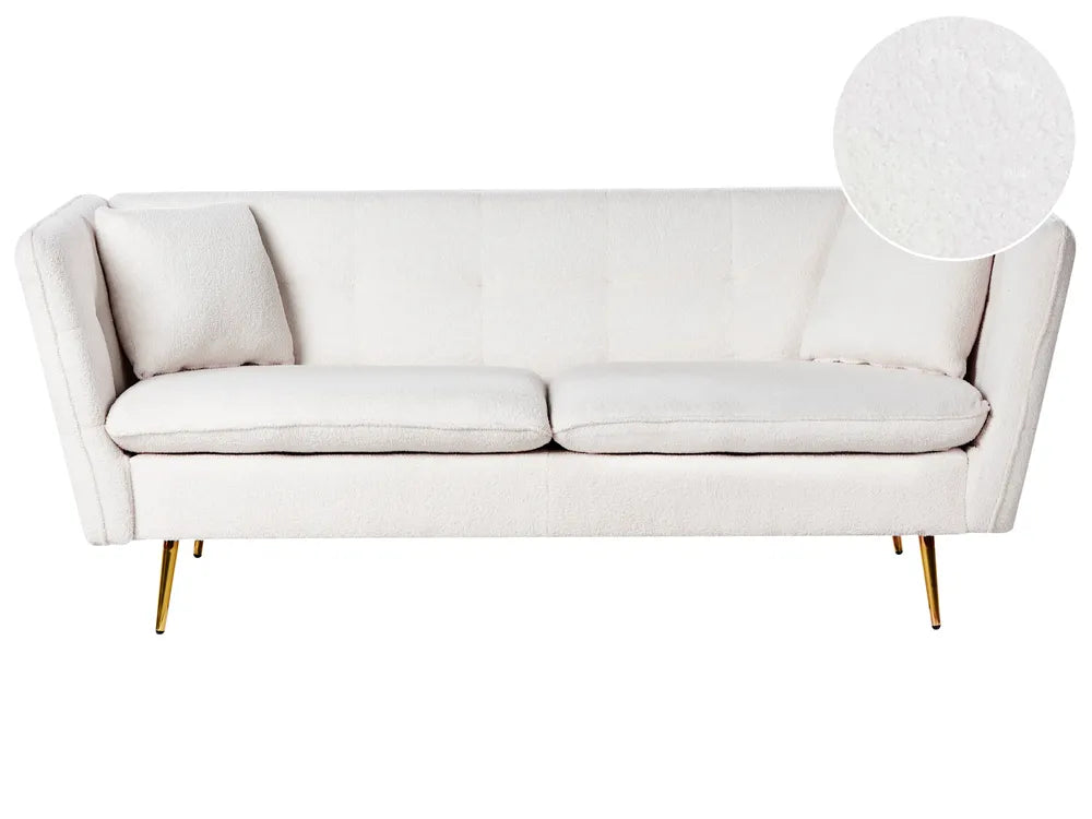 White sofa with gold legs on a white background