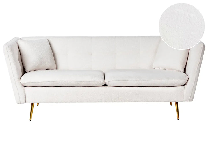 White sofa with gold legs on a white background