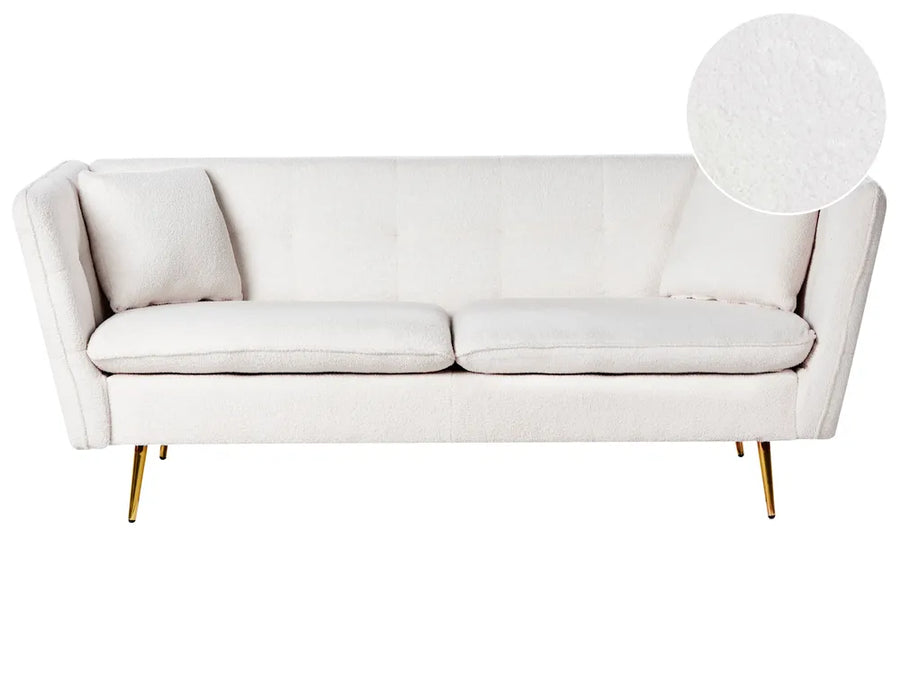 White sofa with gold legs on a white background
