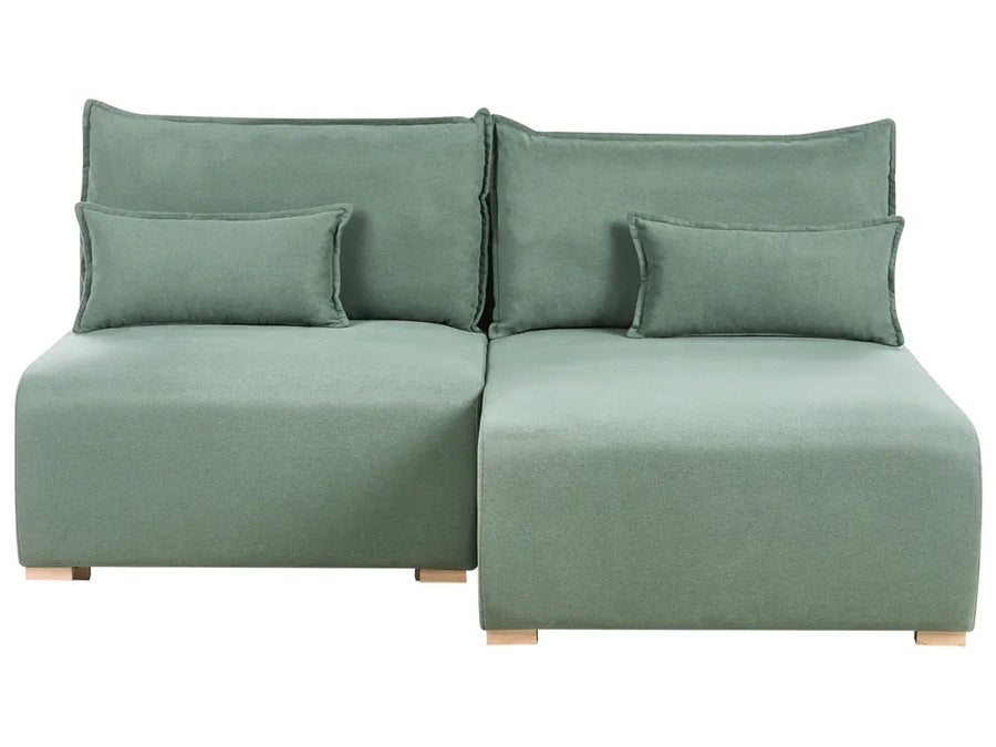 Green sectional sofa with cushions on a white background