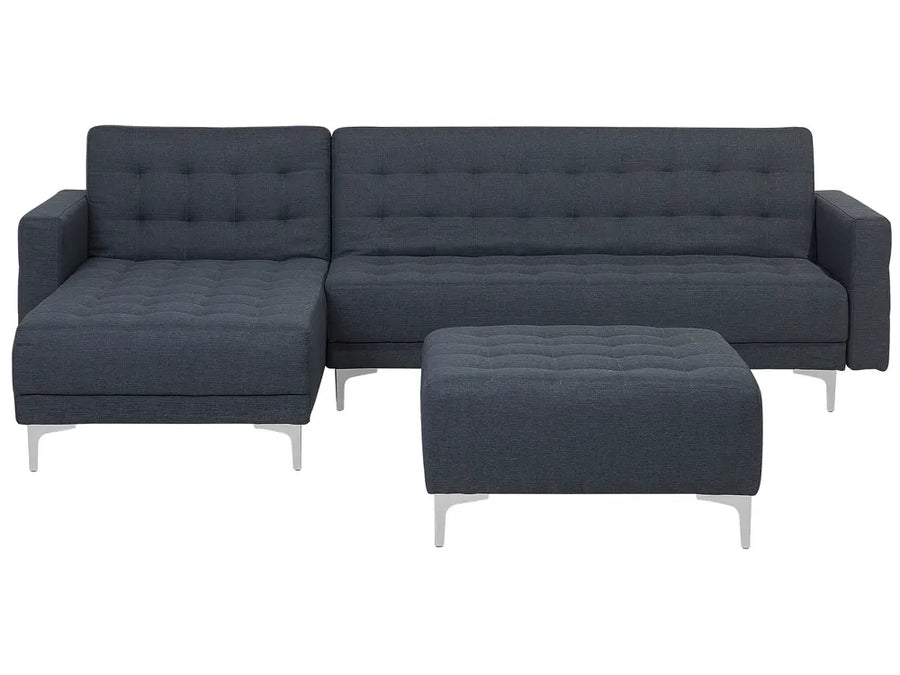Gray sectional sofa with ottoman on a white background