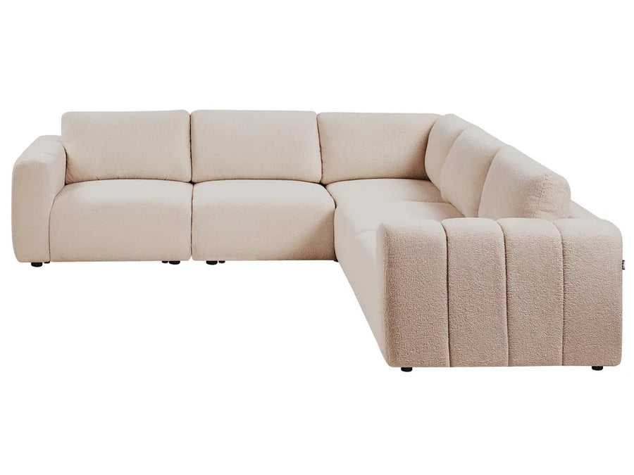 Beige sectional sofa on a white background