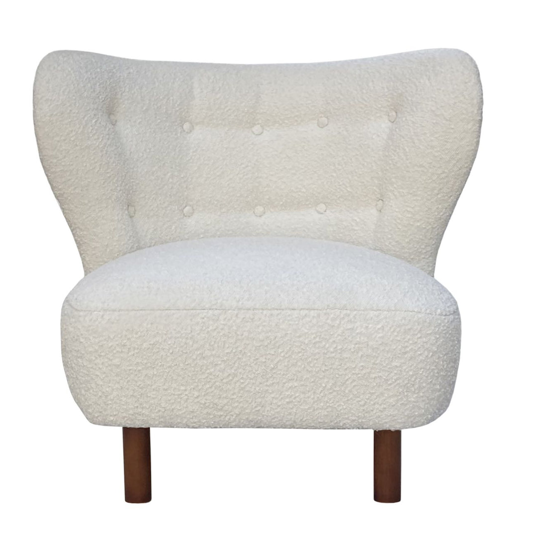 White textured armchair with wooden legs on a white background