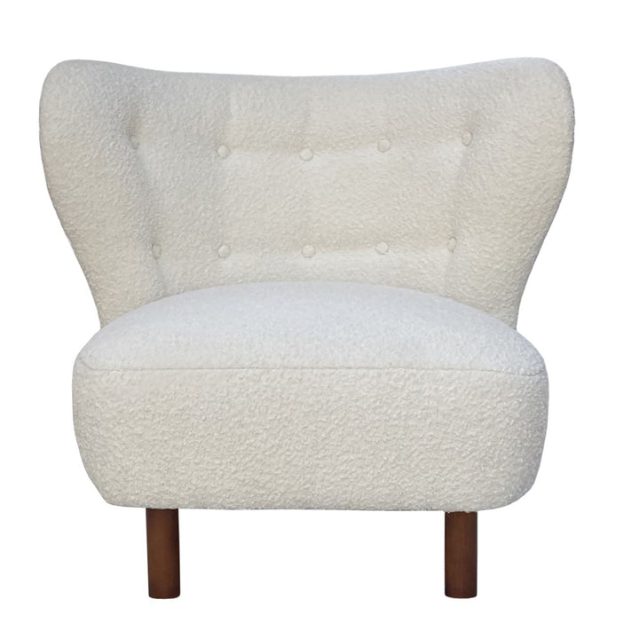 White textured armchair with wooden legs on a white background