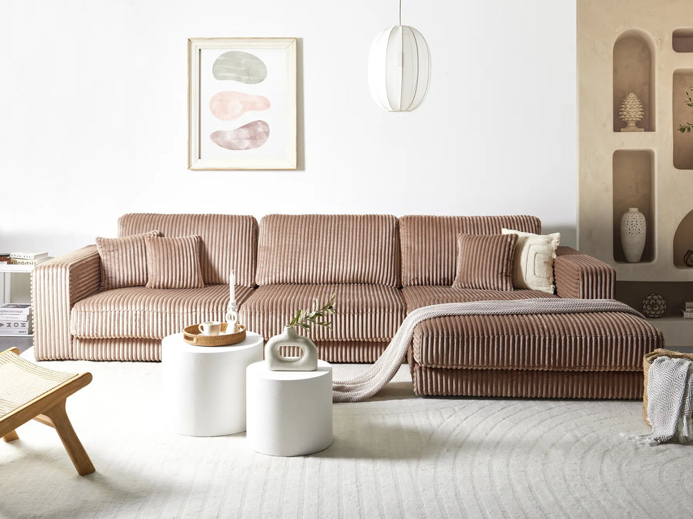 Brown sectional sofa in a modern living room with decor elements.