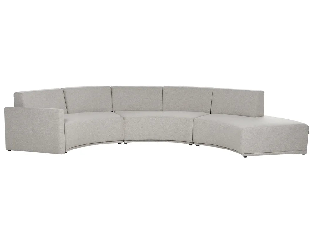 Light grey curved 6-seater linen sofa in a contemporary living room setting
