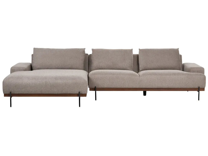 Light brown fabric right‑hand corner sofa with low armrests and three fitted cushions in a modern living room