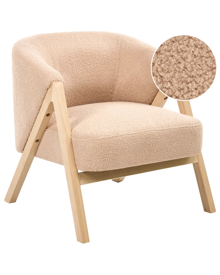 Beige armchair with wooden legs on a white background