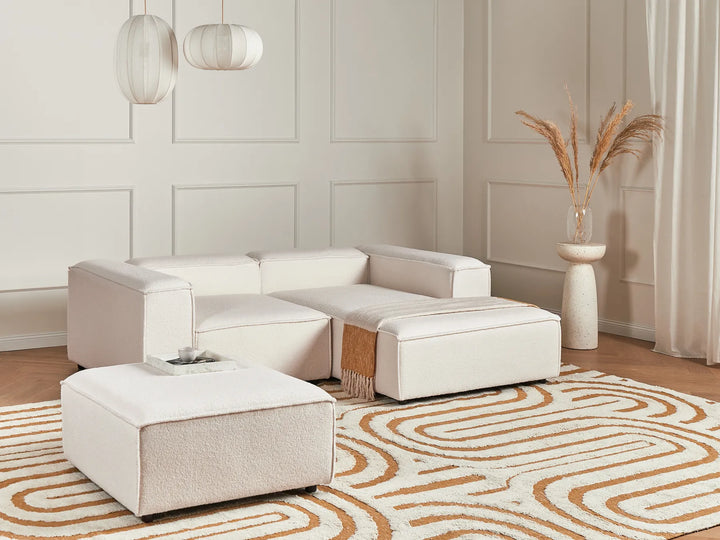 3-seater L-shaped off-white bouclé corner sofa with ottoman, soft textured fabric and contemporary design