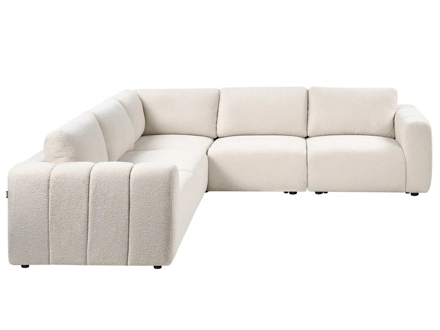 Beige sectional sofa on a white background