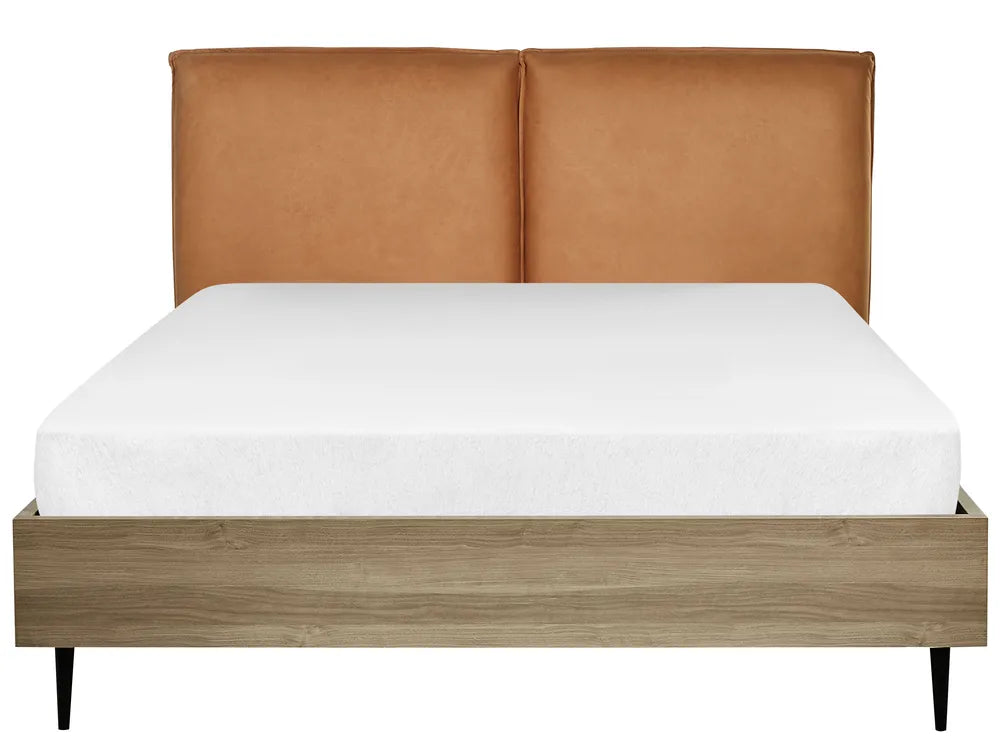Bed with brown leather headboard and wooden frame on a white background