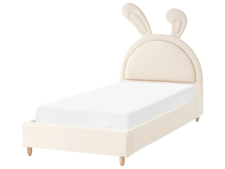 Children's bed with bunny ears headboard on a white background