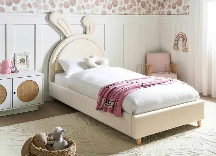 Children's bedroom with a bed, toys, and decorative elements.