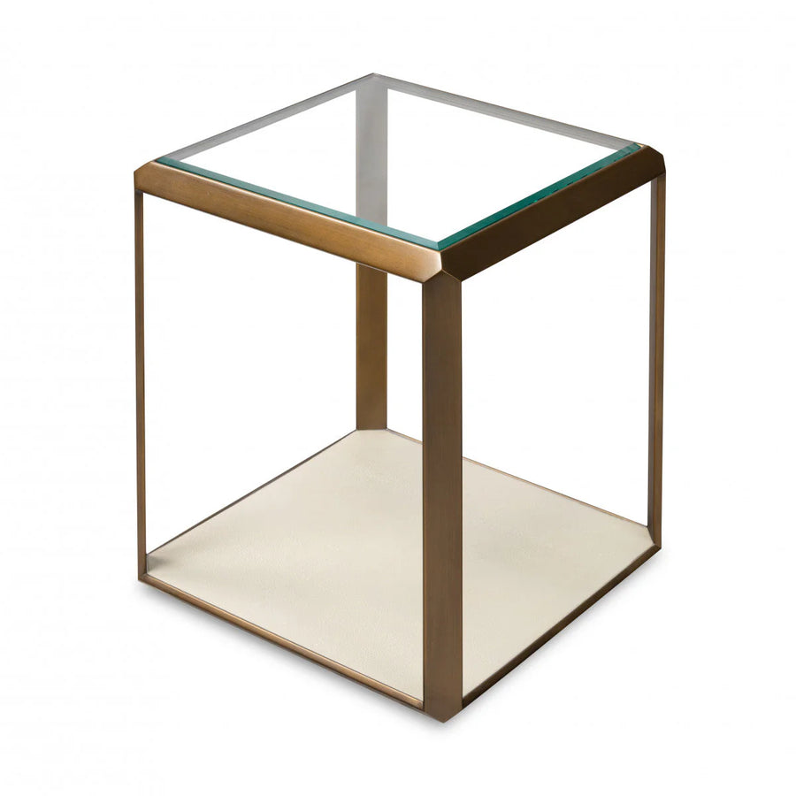 Small side table with glass top and bronze frame on a white background