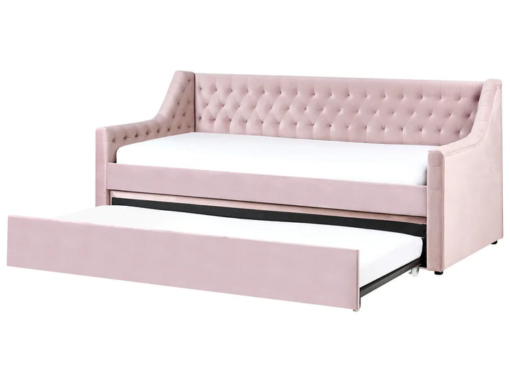 Pink tufted sofa bed with white mattress on a white background