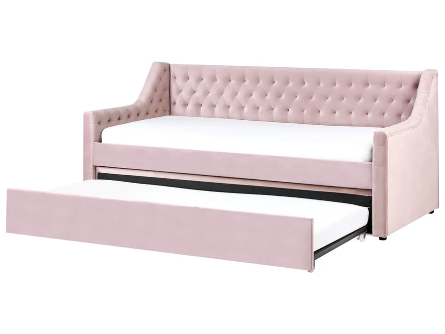 Pink tufted sofa bed with white mattress on a white background