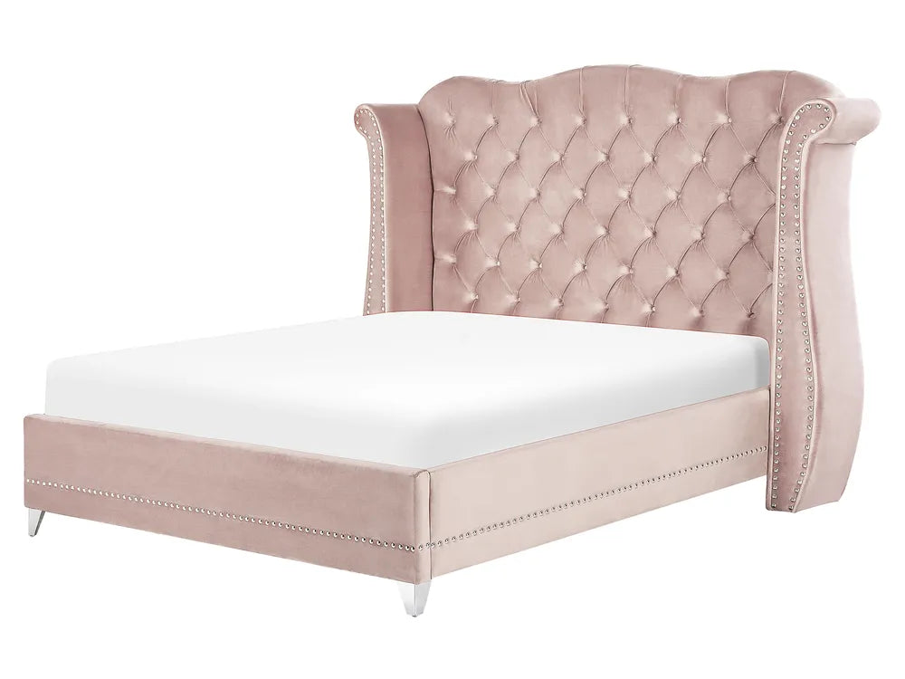 Pastel pink velvet super king bed with winged headboard