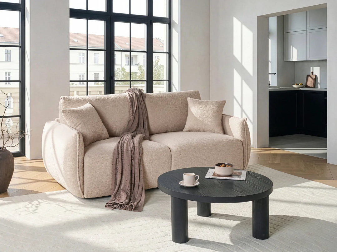 Modern beige bouclé modular loveseat with soft textured upholstery