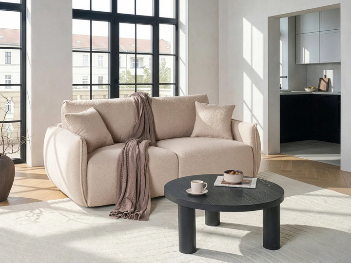 Modern beige bouclé modular loveseat with soft textured upholstery