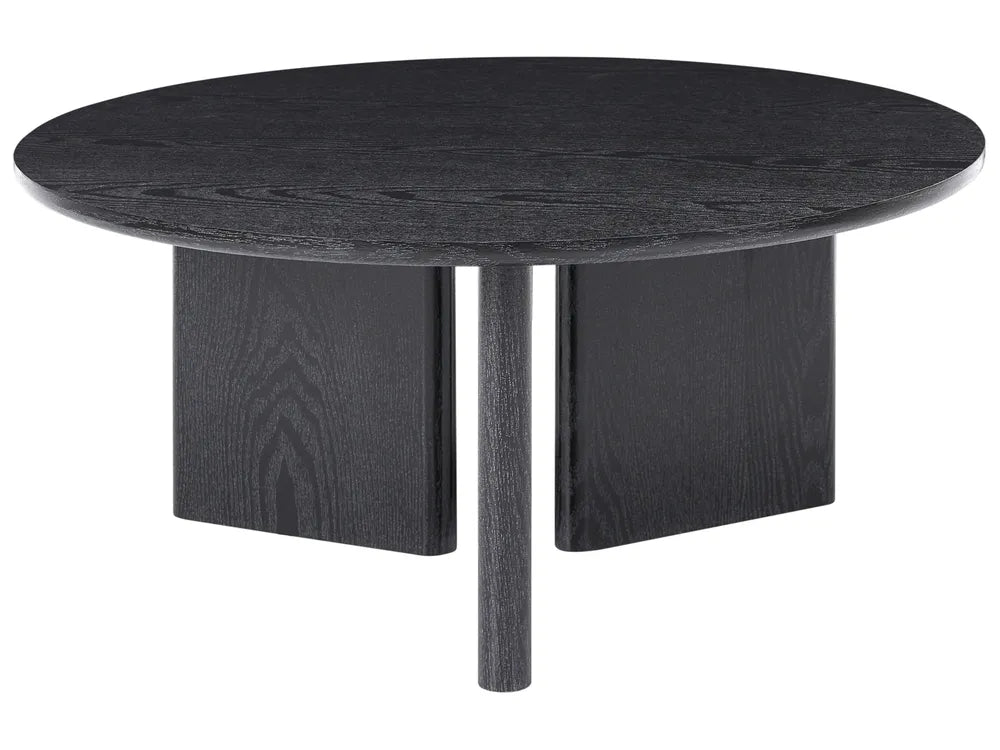 Round black dining table with four legs on a white background