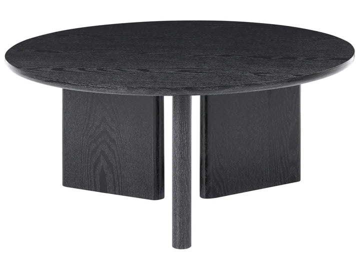 Round black dining table with four legs on a white background