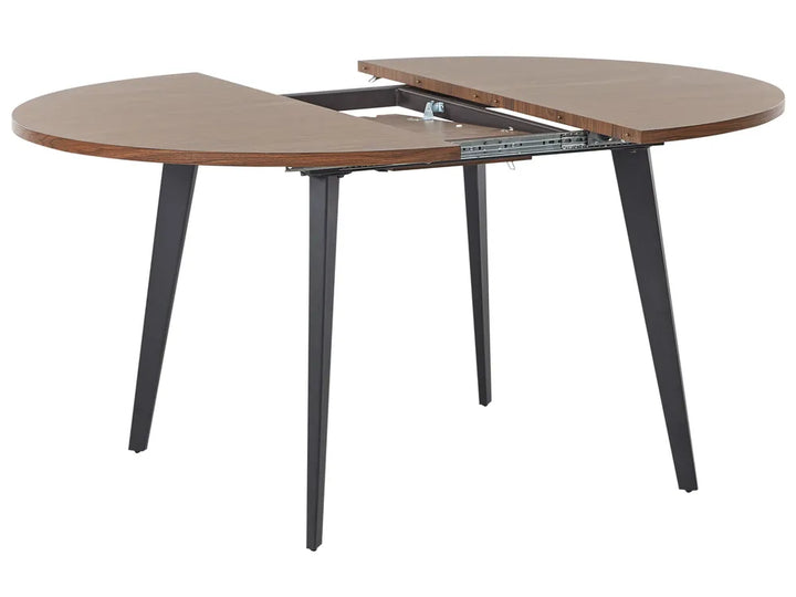 Wooden dining table with extended leaf on a white background