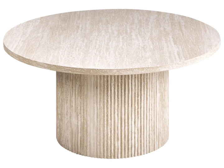 Round dining table with textured surface on a white background
