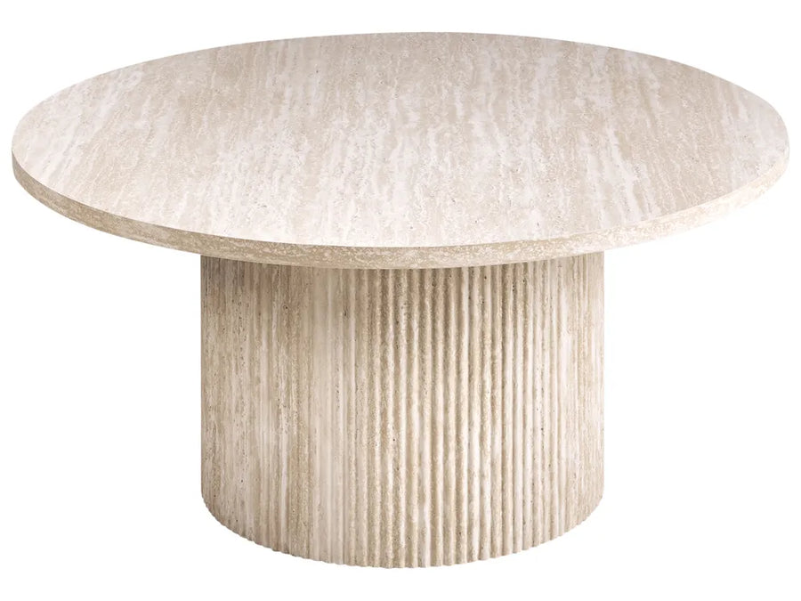 Round dining table with textured surface on a white background