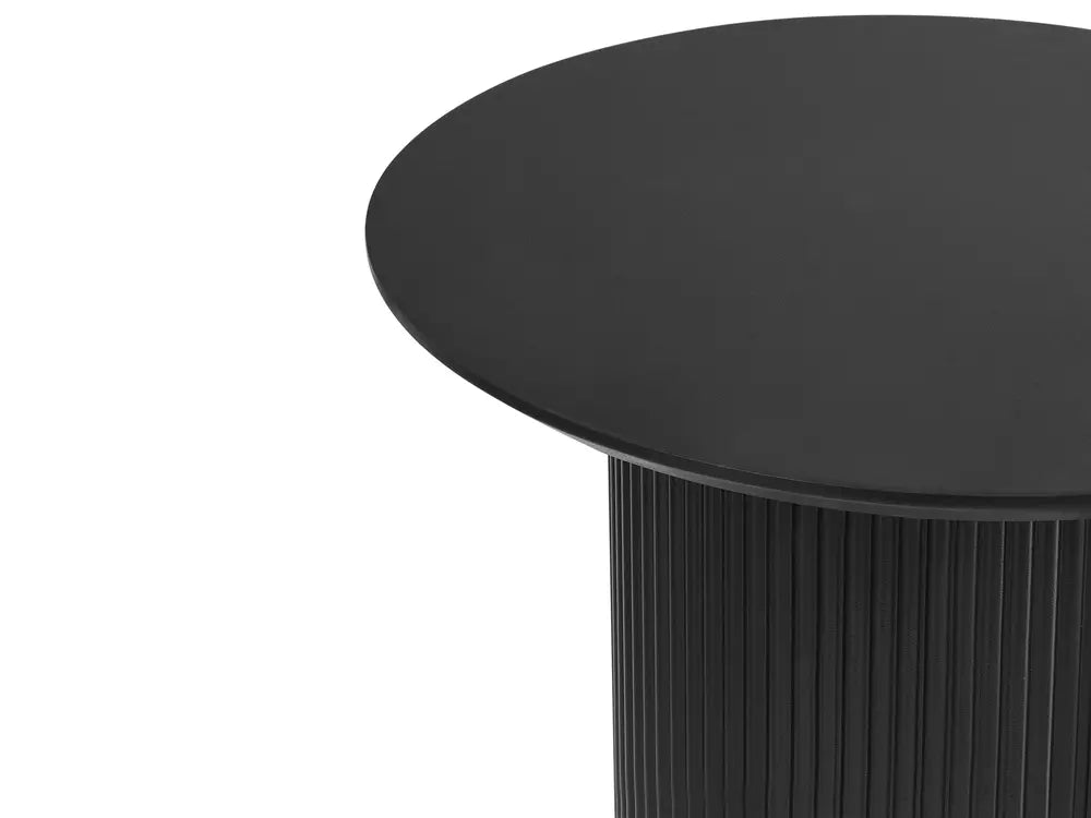 Black round table with a textured base on a white background
