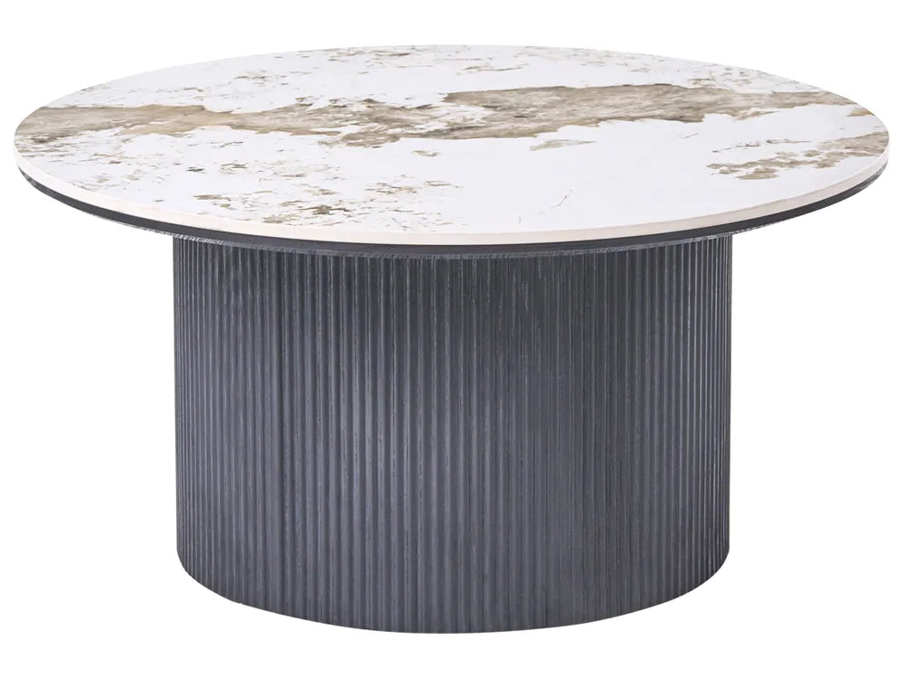 Round table with marble-like top and ribbed gray base on a white background