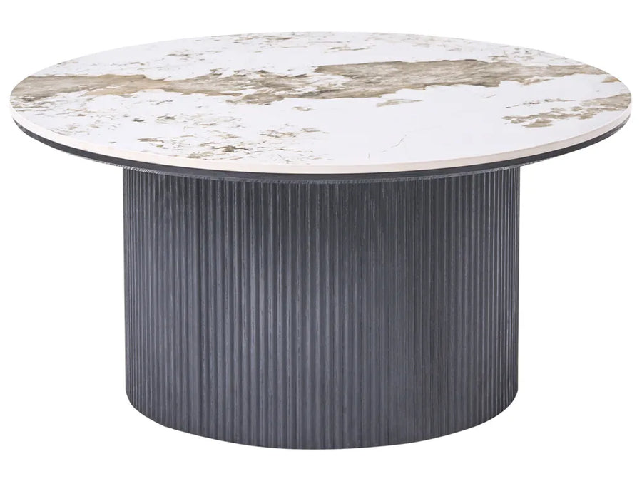 Round table with marble-like top and ribbed gray base on a white background