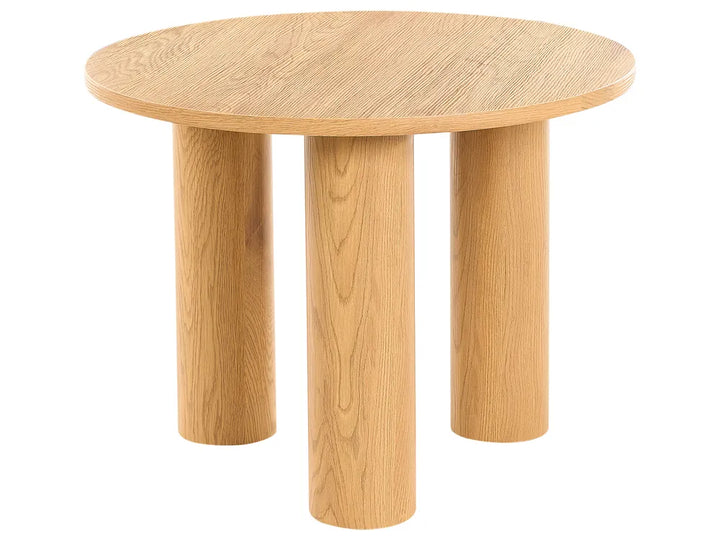 Wooden round table with four legs on a white background