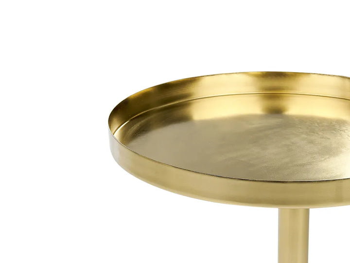 Gold side table on a white background